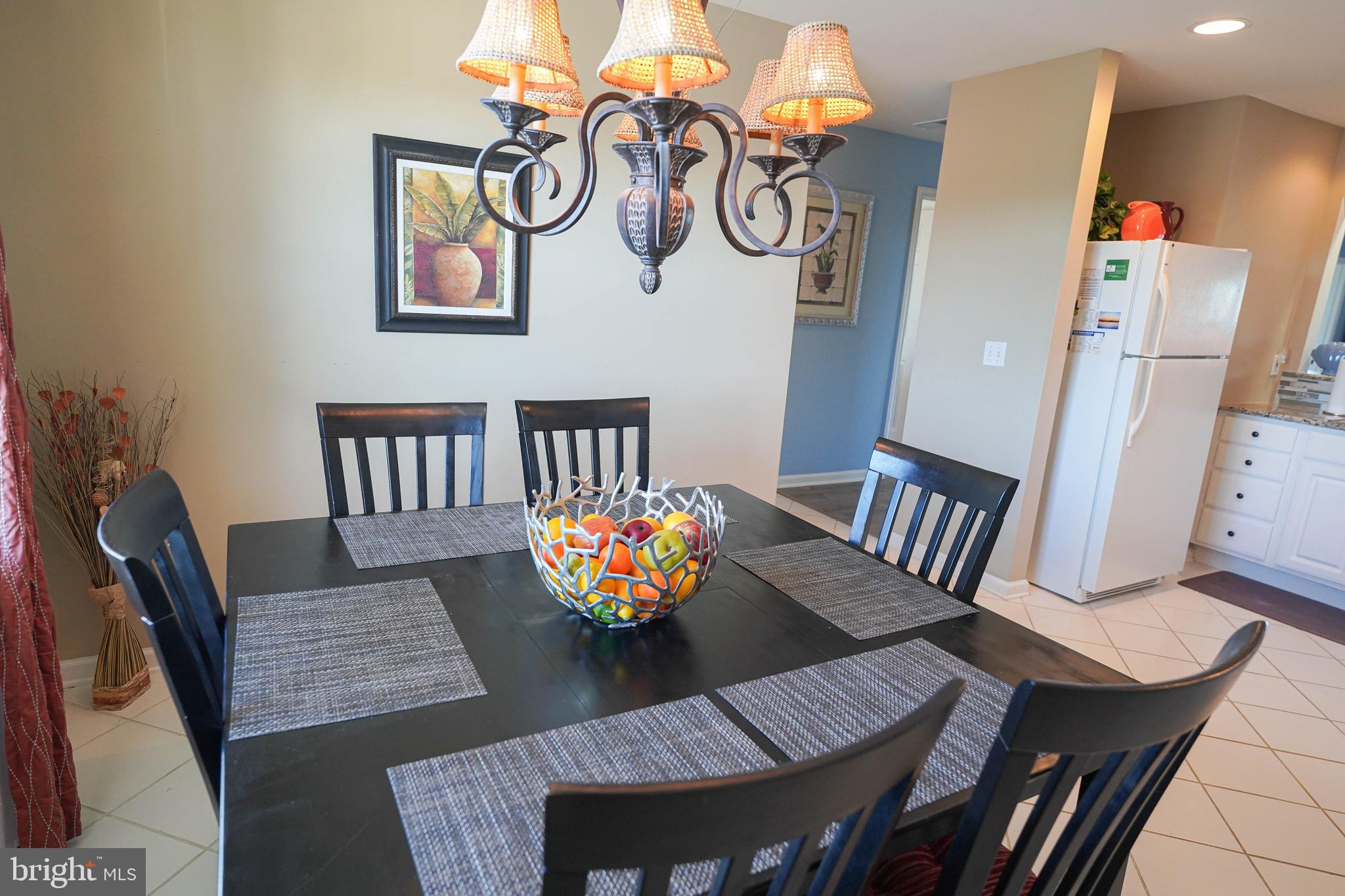 37182 Harbor Drive, Unit 264 Ocean View, DE 19970 - Photo 26 of 55 a view of a dining room with furniture and wooden floor