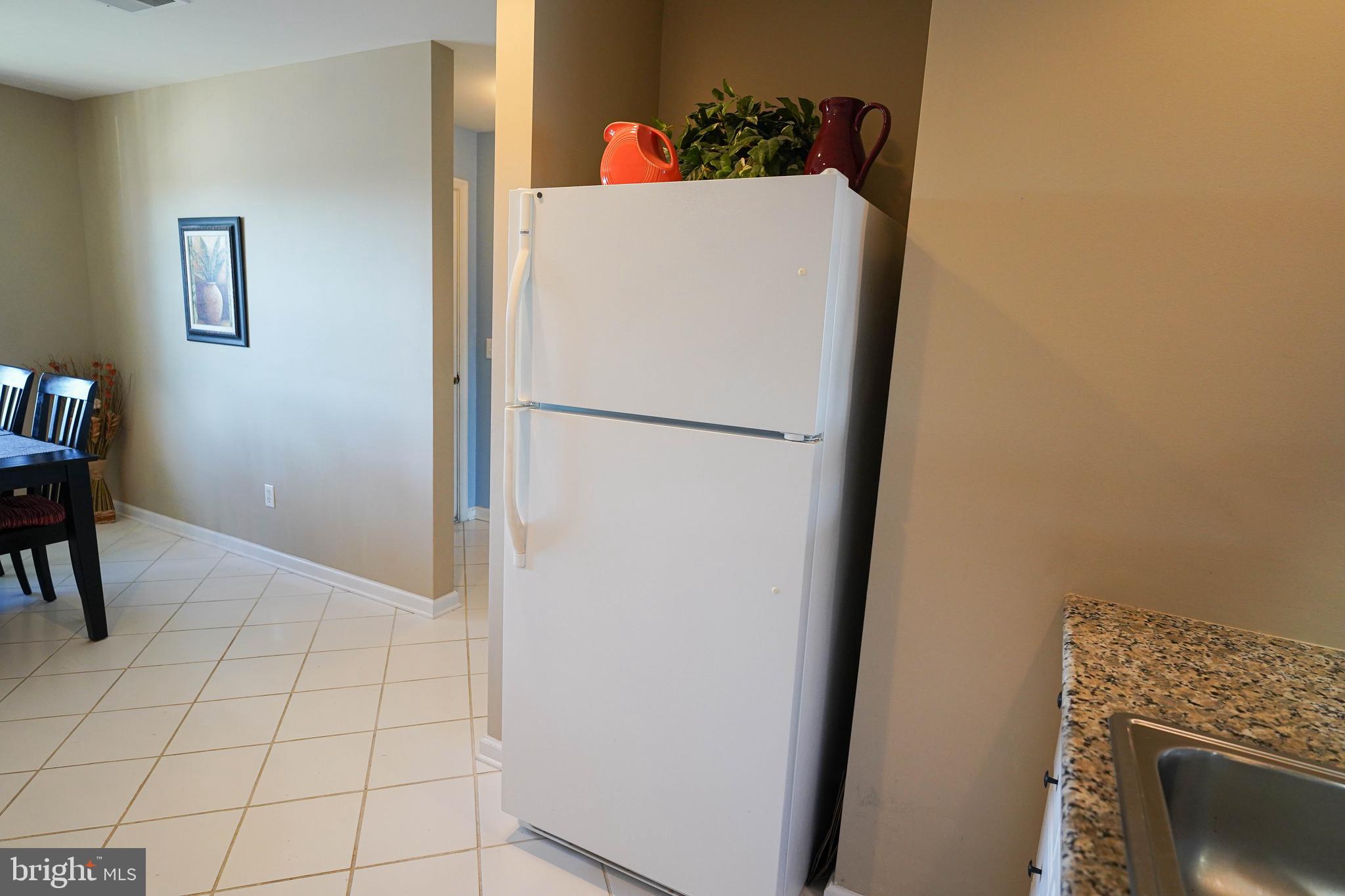37182 Harbor Drive, Unit 264 Ocean View, DE 19970 - Photo 32 of 55 a white refrigerator freezer sitting in a kitchen