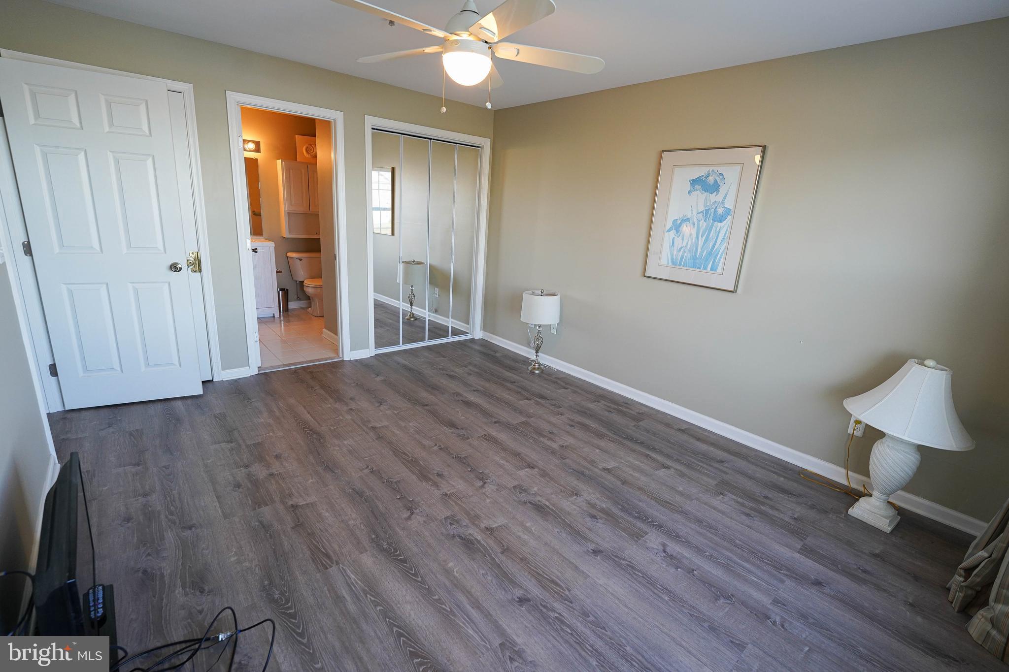 37182 Harbor Drive, Unit 264 Ocean View, DE 19970 - Photo 37 of 55 a view of a room with wooden floor and cabinet