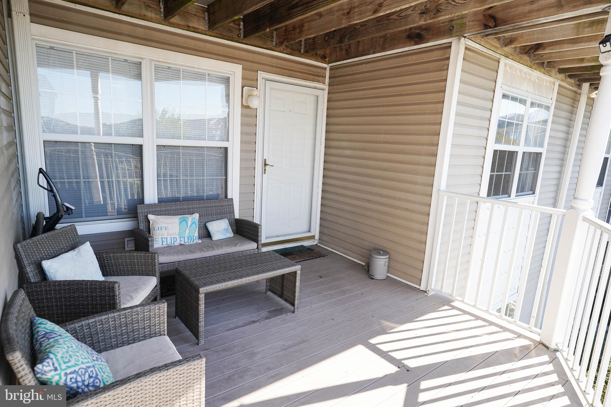 37182 Harbor Drive, Unit 264 Ocean View, DE 19970 - Photo 4 of 55 a outdoor living space with furniture and a window