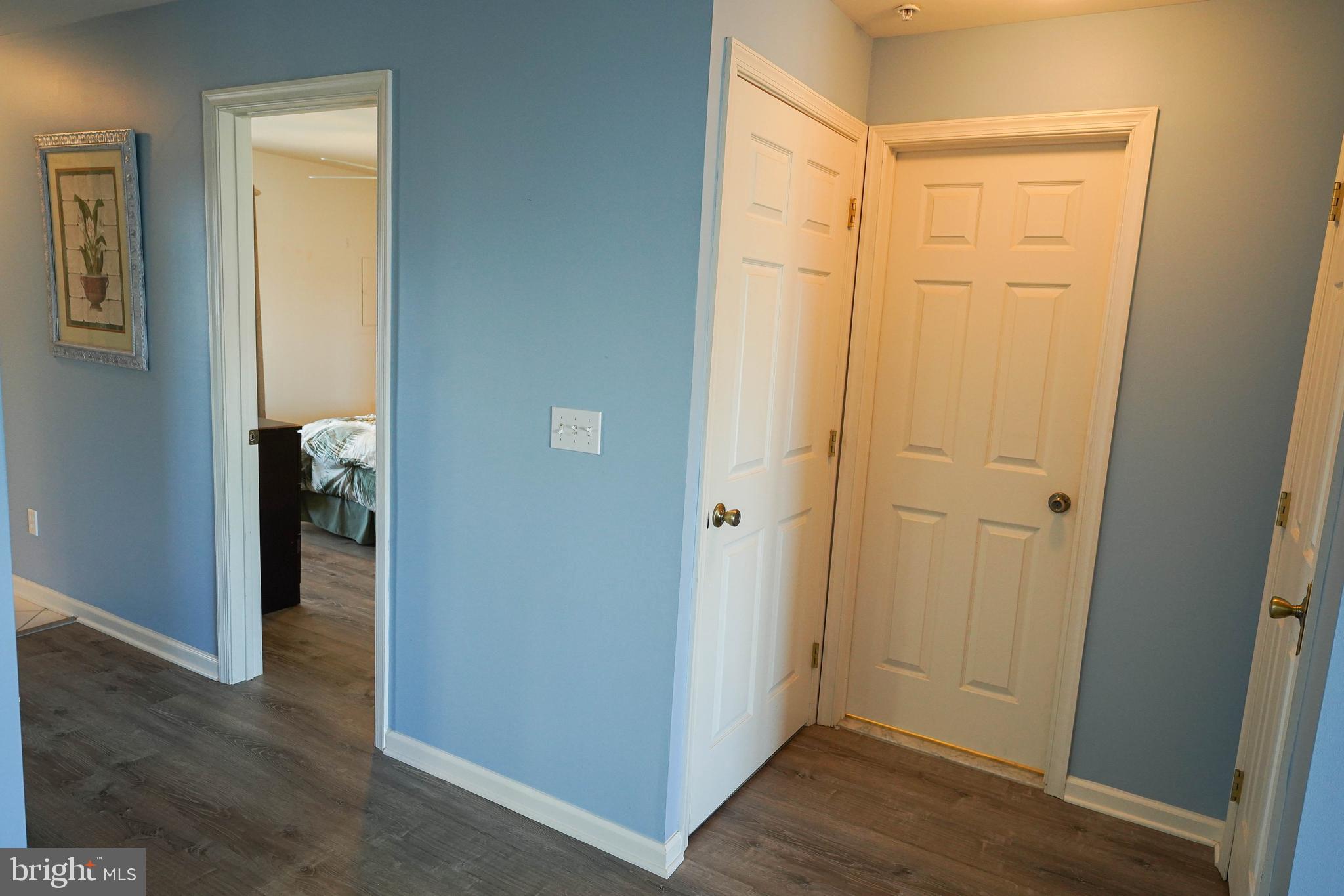 37182 Harbor Drive, Unit 264 Ocean View, DE 19970 - Photo 43 of 55 a view of a hallway with wooden floor