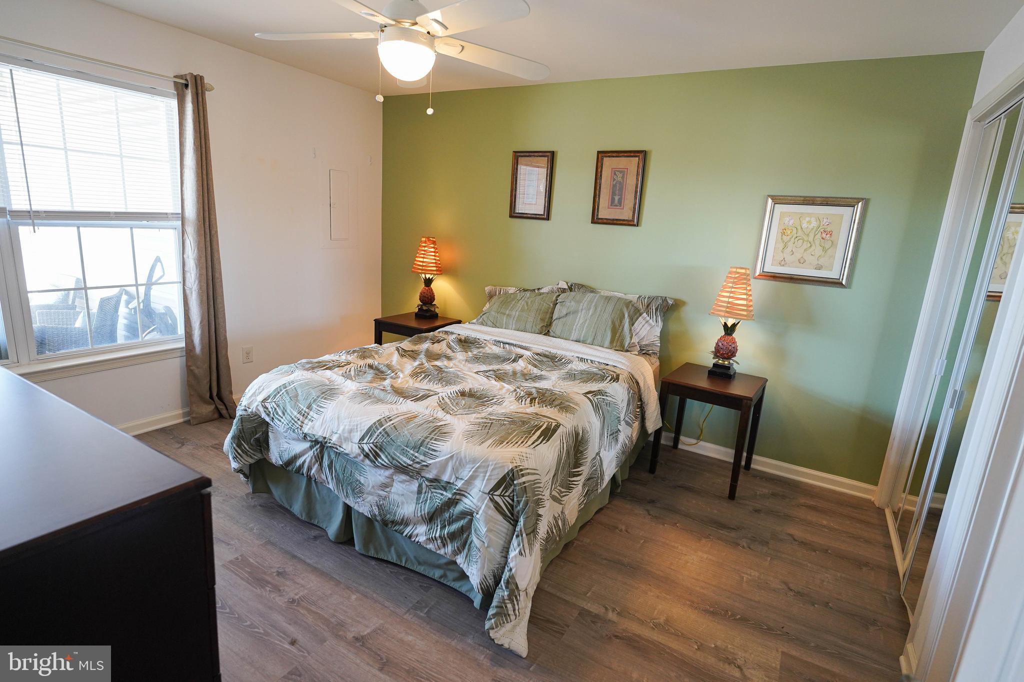 37182 Harbor Drive, Unit 264 Ocean View, DE 19970 - Photo 44 of 55 a bedroom with a bed and a table in it