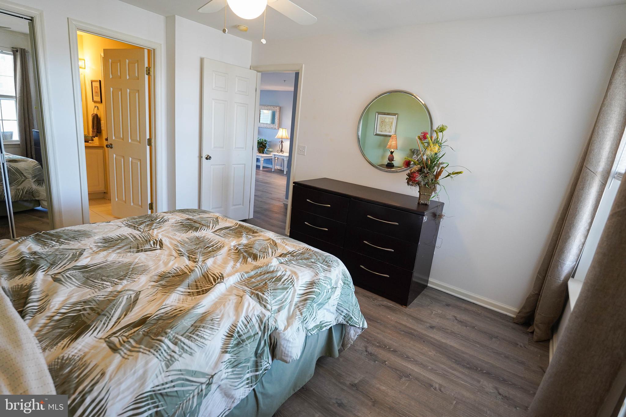 37182 Harbor Drive, Unit 264 Ocean View, DE 19970 - Photo 46 of 55 a bedroom with a bed and a dresser