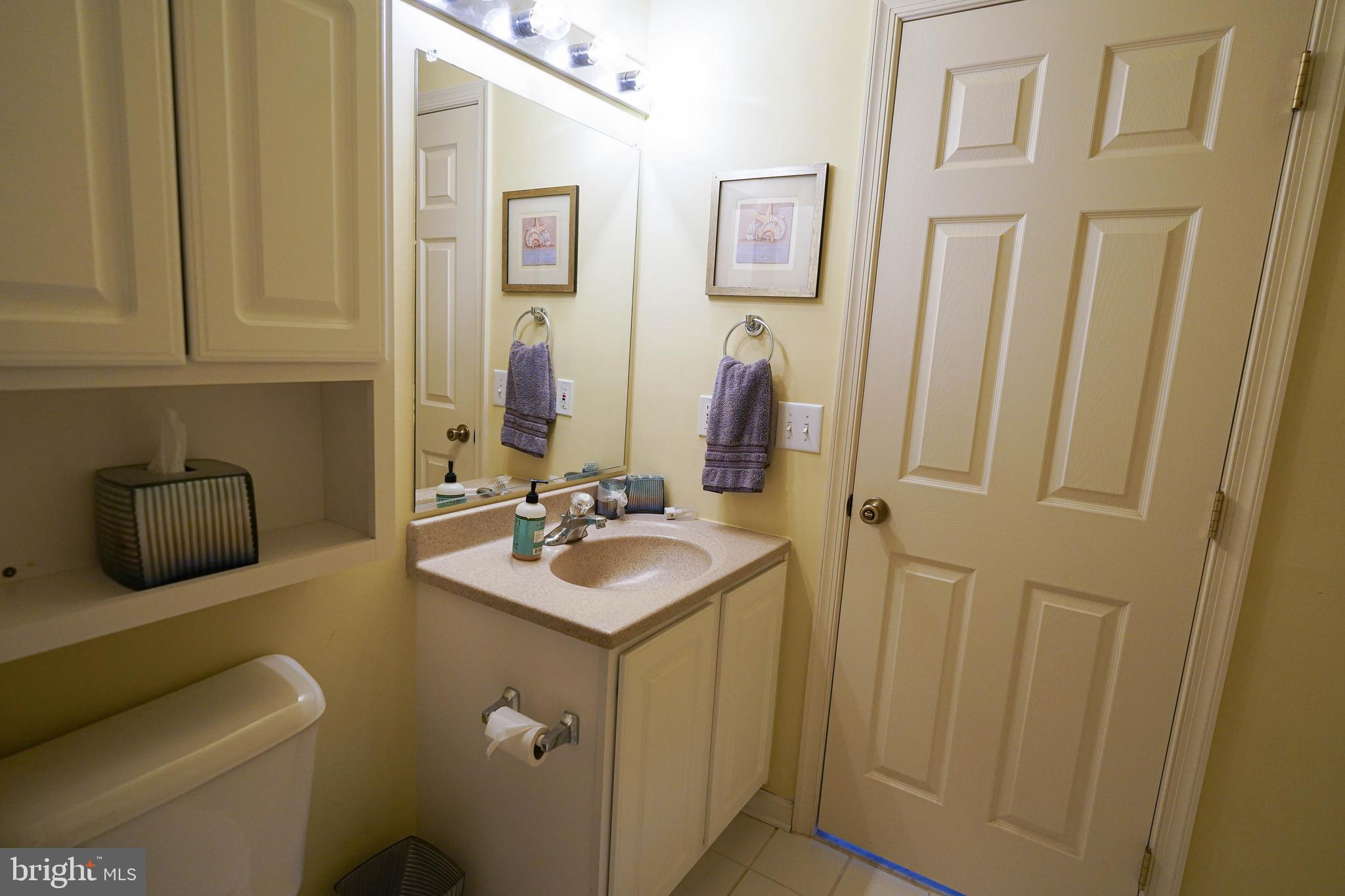 37182 Harbor Drive, Unit 264 Ocean View, DE 19970 - Photo 49 of 55 a bathroom with 2 sink and a mirror