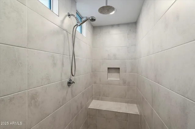 a bathroom with a sink vanity and mirror