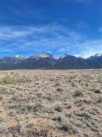 a view of a large body of water with a mountain in the background