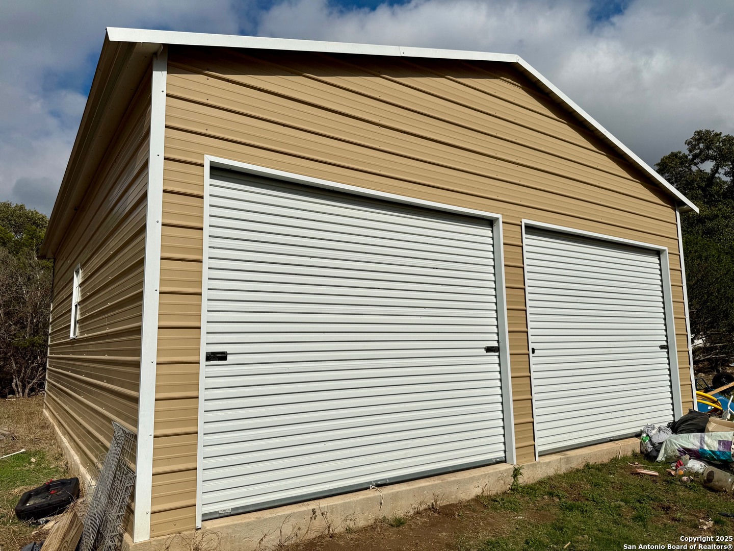 1400 Knoll Schwope Road Spring Branch, TX 78070 - Photo 9 of 12 a view of a house with a garage