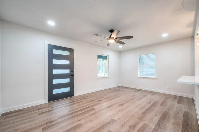 a view of an empty room with a window