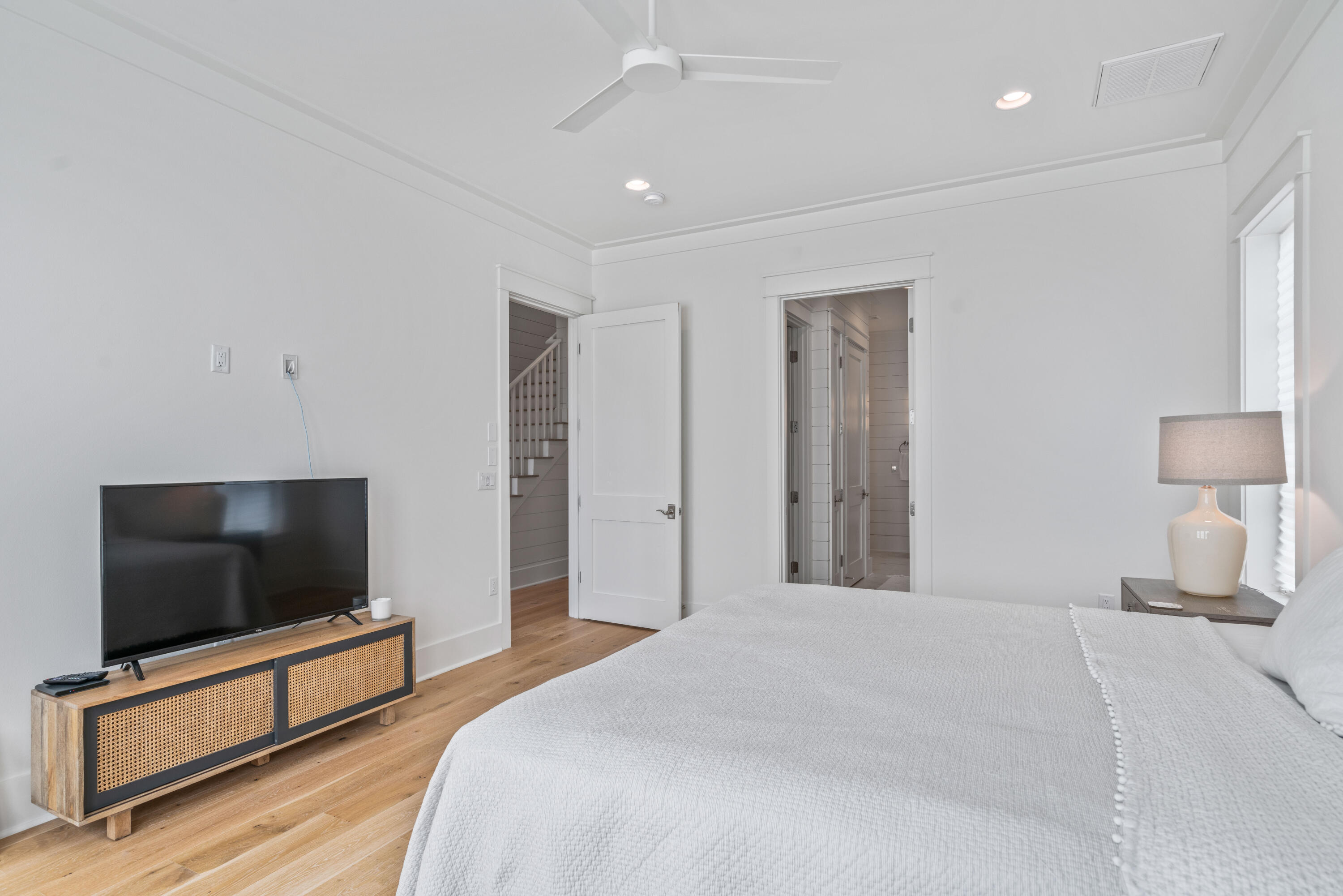 888 Pathways Dr Inlet Beach Inlet Beach, FL 32461 - Photo 25 of 43 a bedroom with a bed and a flat screen tv