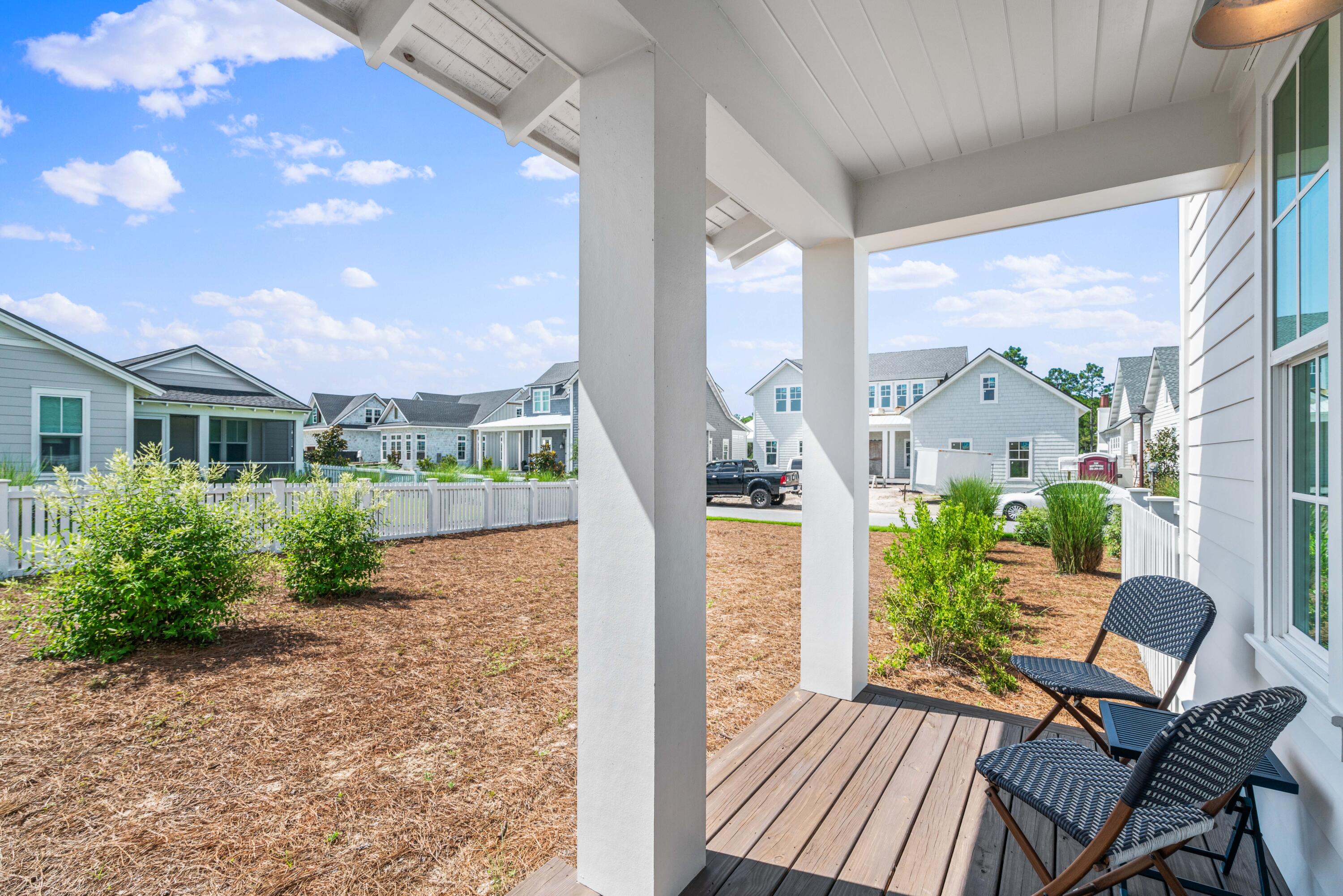 888 Pathways Dr Inlet Beach Inlet Beach, FL 32461 - Photo 29 of 43 a front view of a house with garden