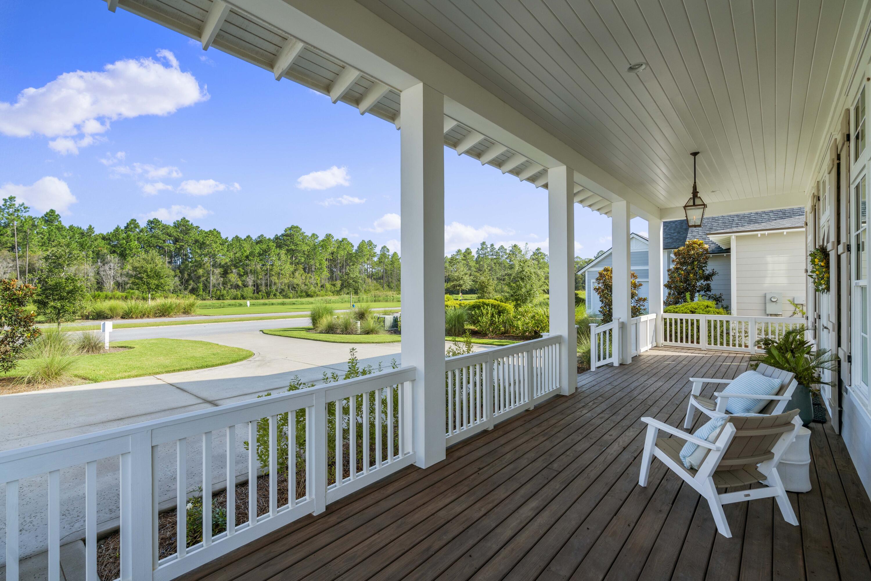 888 Pathways Dr Inlet Beach Inlet Beach, FL 32461 - Photo 5 of 43 a view of a chair and tables in the balcony