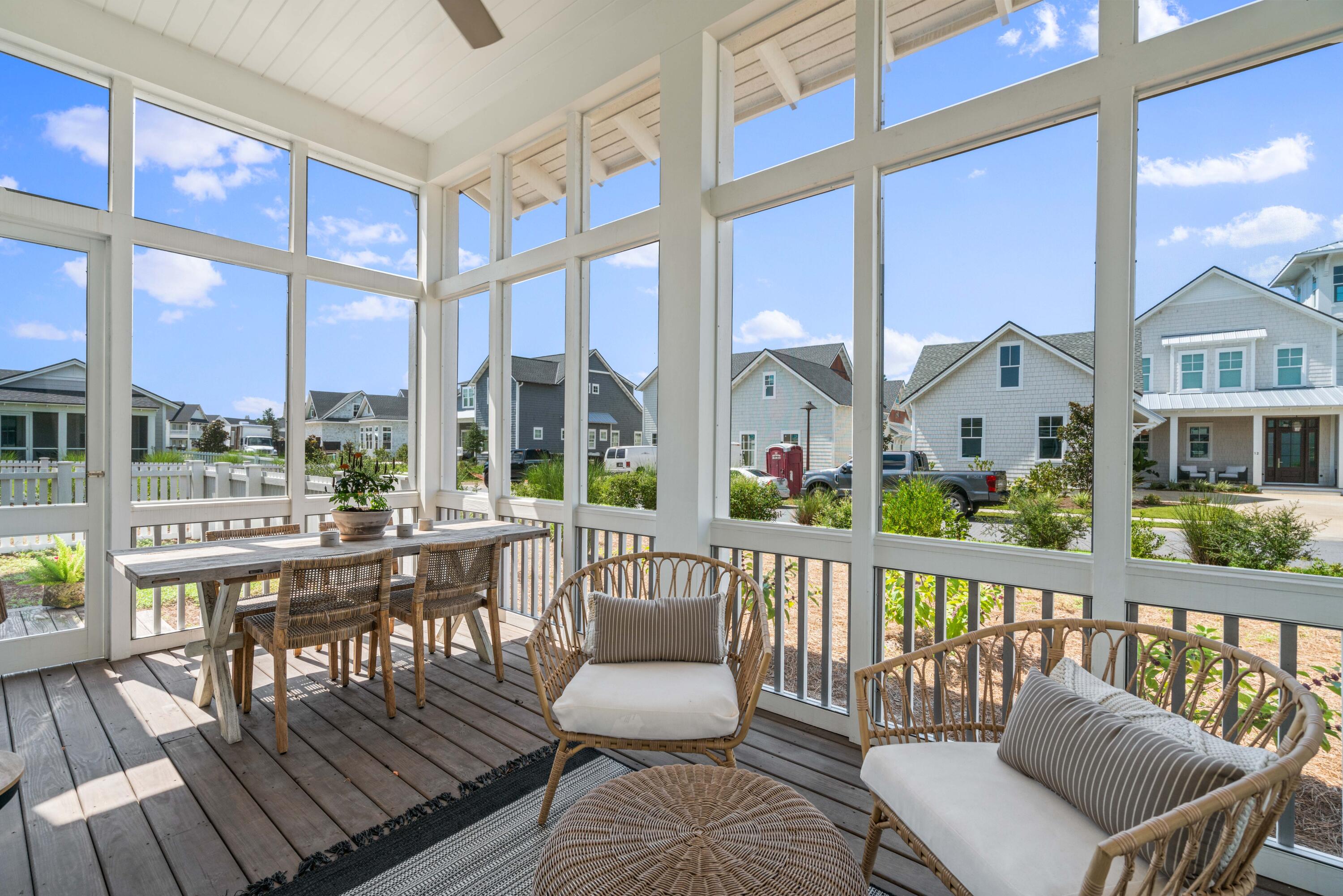 888 Pathways Dr Inlet Beach Inlet Beach, FL 32461 - Photo 9 of 43 a view of a balcony with wooden floor and outdoor seating