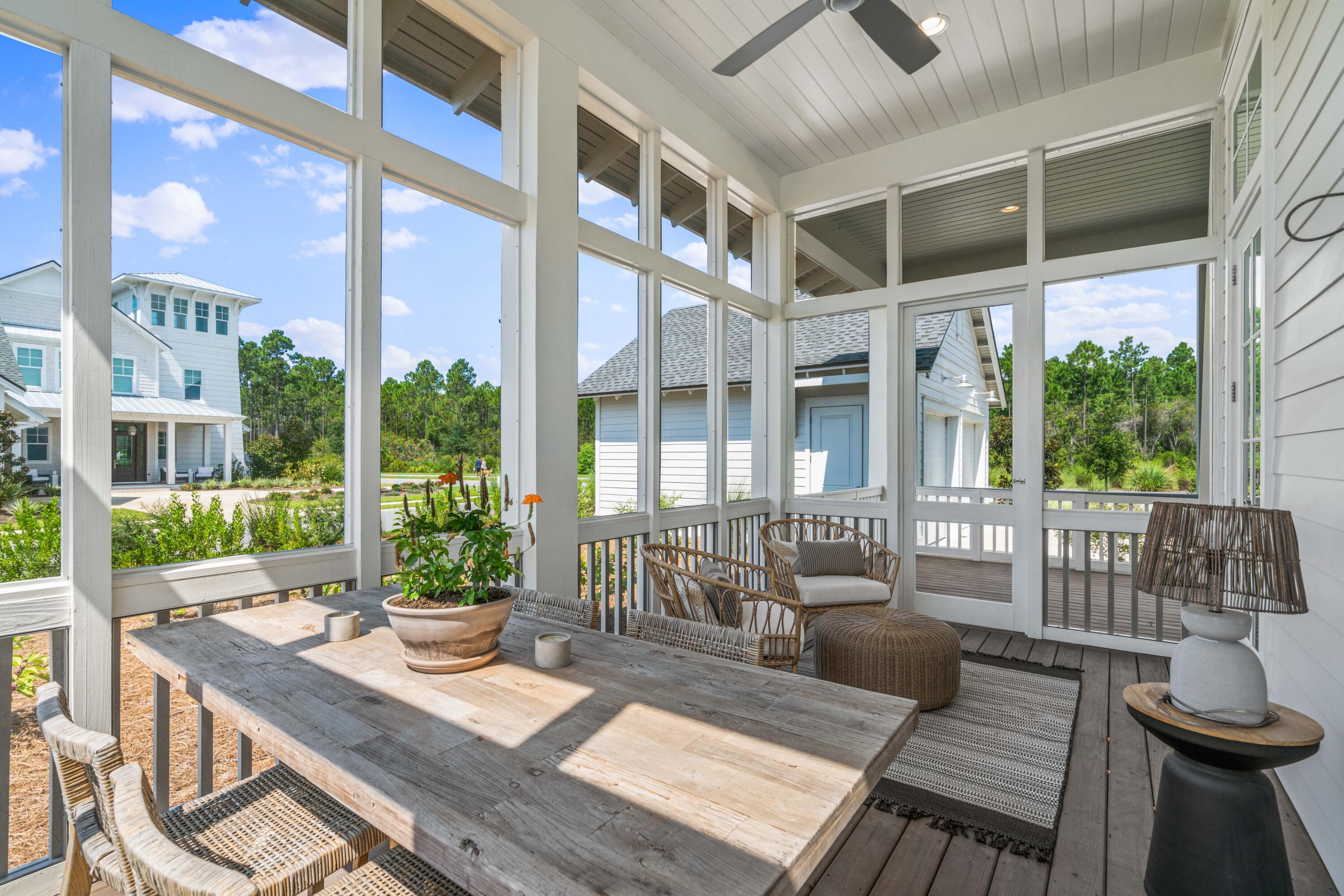 888 Pathways Dr Inlet Beach Inlet Beach, FL 32461 - Photo 10 of 43 a view of a patio with couches table and chairs and potted plants