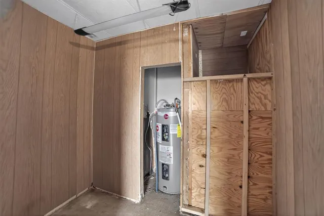 a bathroom with a shower and a glass door