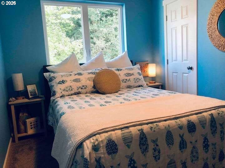 16319 Lower Harbor Road Brookings, OR 97415 - Photo 20 of 23 a bedroom with a large bed and a window