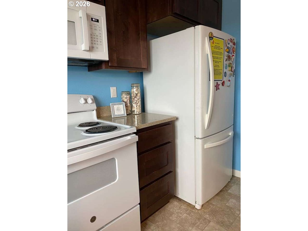 16319 Lower Harbor Road Brookings, OR 97415 - Photo 8 of 23 a kitchen with a refrigerator and a stove