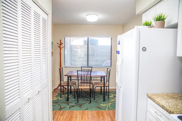 a kitchen with a table and chairs