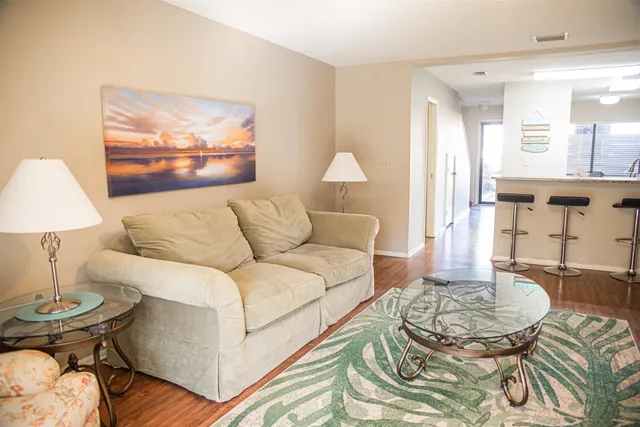 a living room with furniture and a table