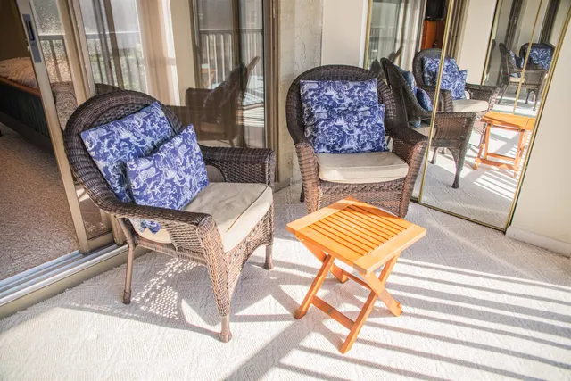 a view of a living room filled with furniture