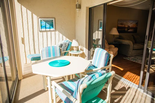 a dining room with furniture and a window