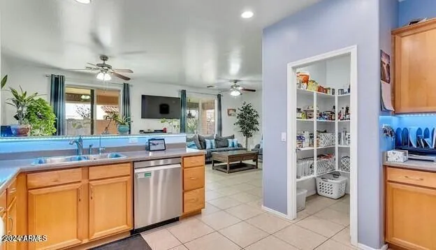 a living room with furniture kitchen view and a window