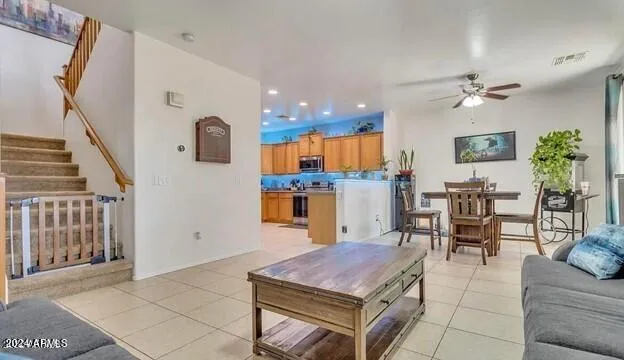 a dining room with furniture and a chandelier