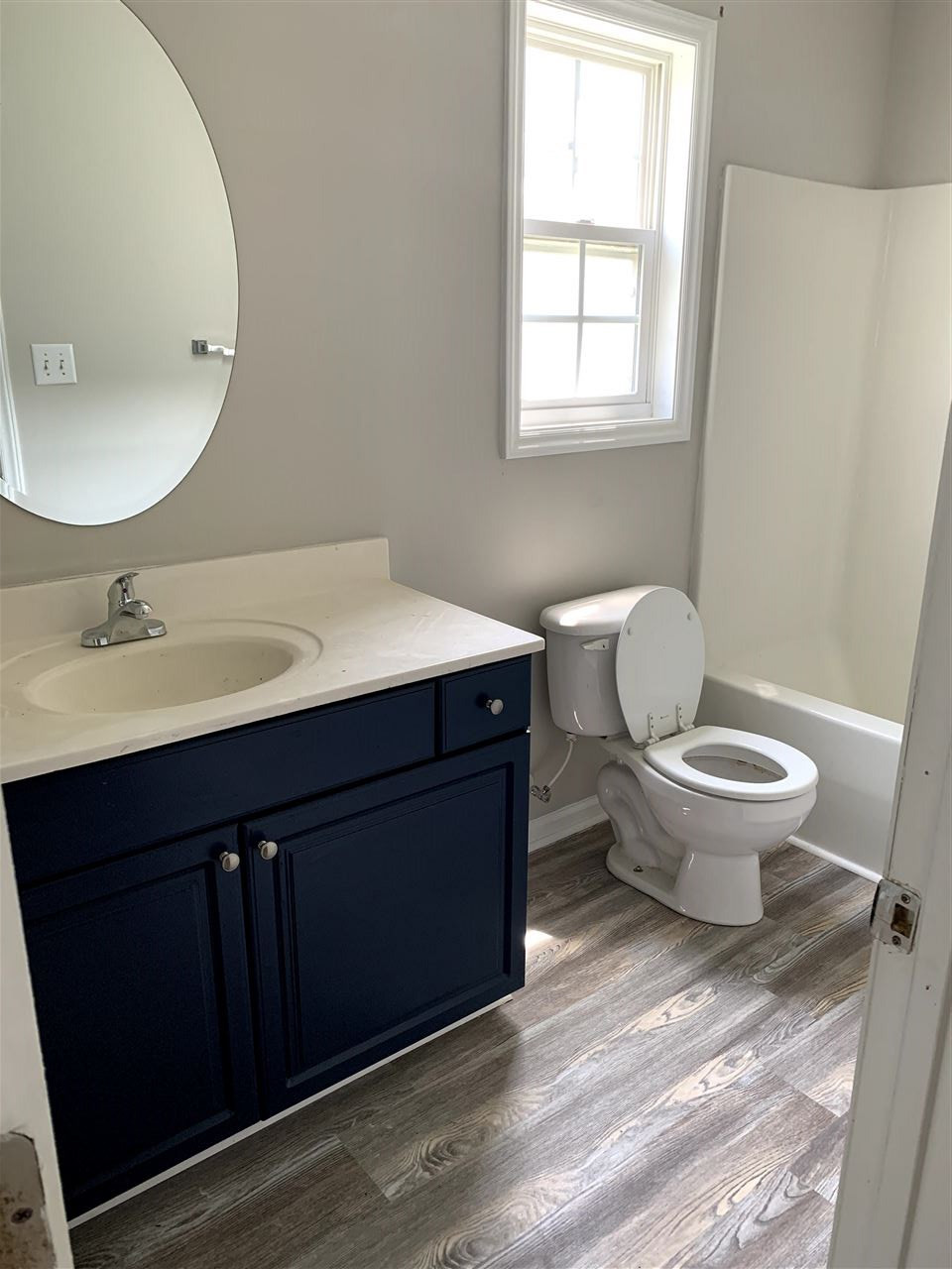 1929 Red Quartz Drive Raleigh, NC 27610 - Photo 8 of 12 large bathroom with tub/shower combo. new luxury vinyl plank floors and new fixtures. upstairs shared bath