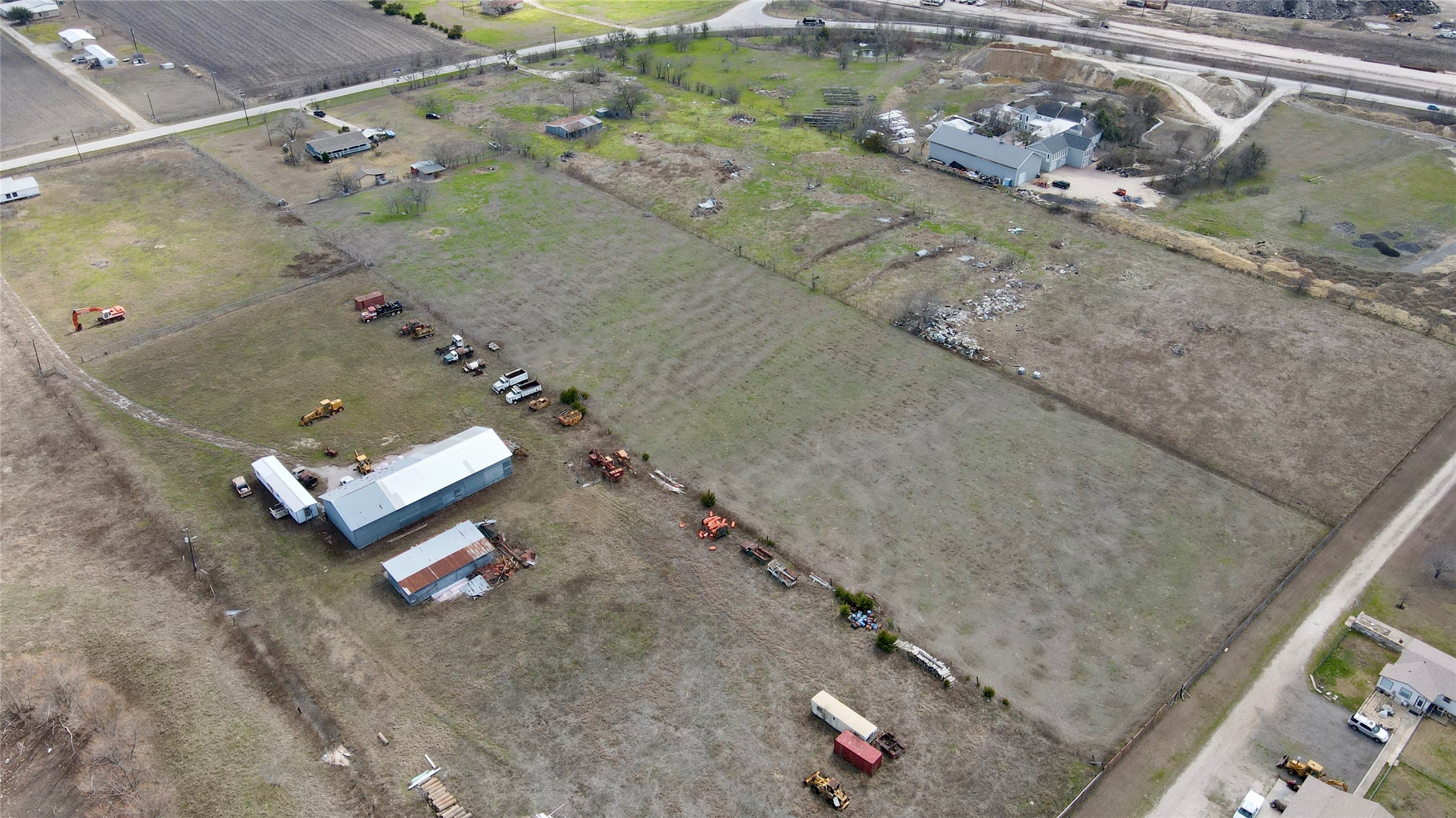 12322 Old Kimbro Road Manor, TX 78653 - Photo 10 of 18 an aerial view of a house with a backyard