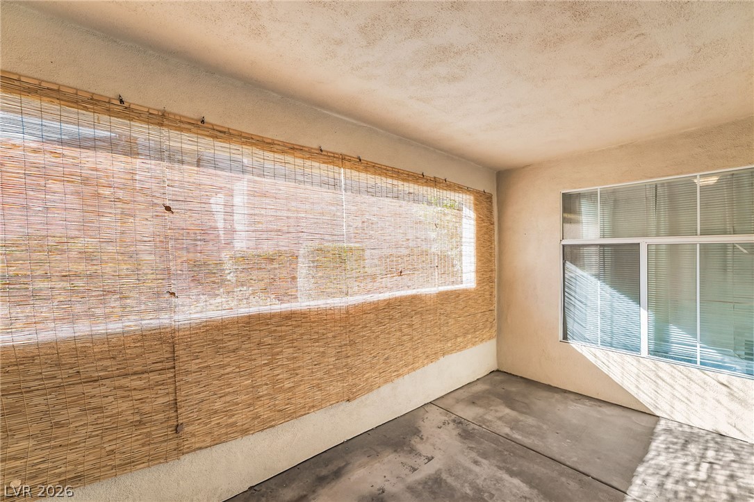 2050 West Warm Springs Road, Unit 2411 Henderson, NV 89014 - Photo 31 of 37 A private, covered patio area offers a tranquil outdoor escape.