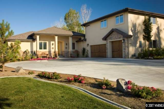 490 Genovese Lane Reno, NV 89511 - Photo 2 of 9 a front view of a house with a yard