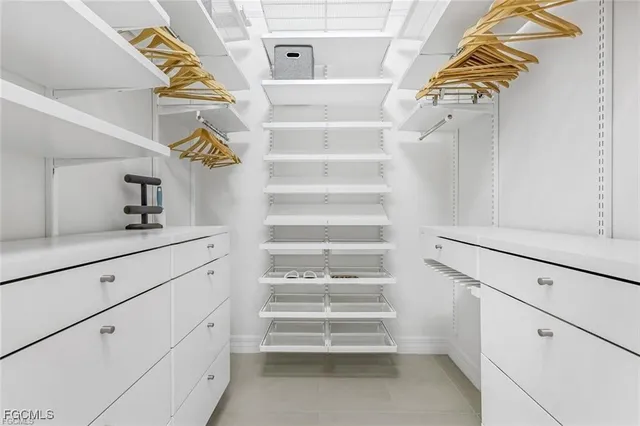 a view of staircase and white cabinets