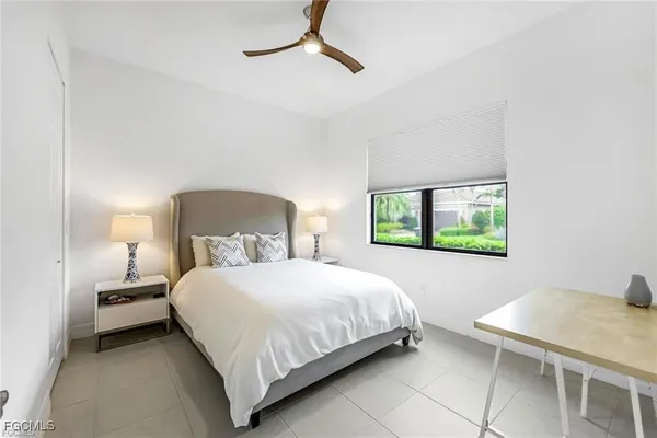a bedroom with a bed and a table