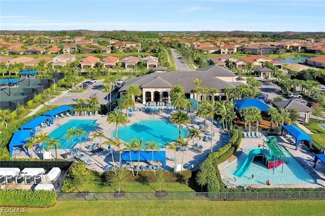 an aerial view of residential building and car parked