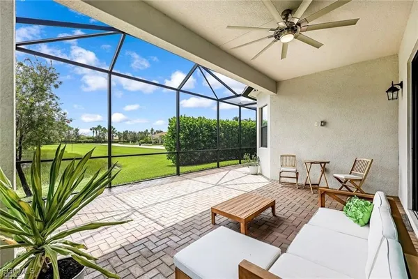 a view of a patio with a table and chairs
