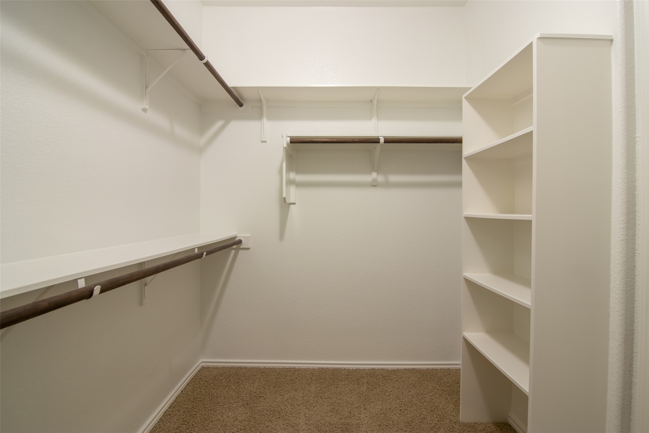 12104 Broten Street Austin, TX 78748 - Photo 20 of 32 Ample shelving and hanging space in this well-organized walk-in closet for effortless storage.