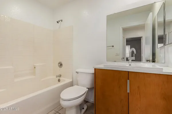 a bathroom with a sink a toilet and a bathtub