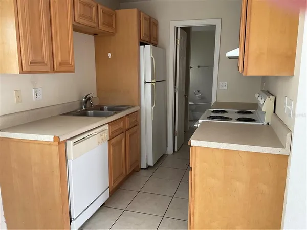 a utility room with sink washer and dryer