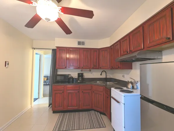 a kitchen with stainless steel appliances granite countertop a sink and cabinets