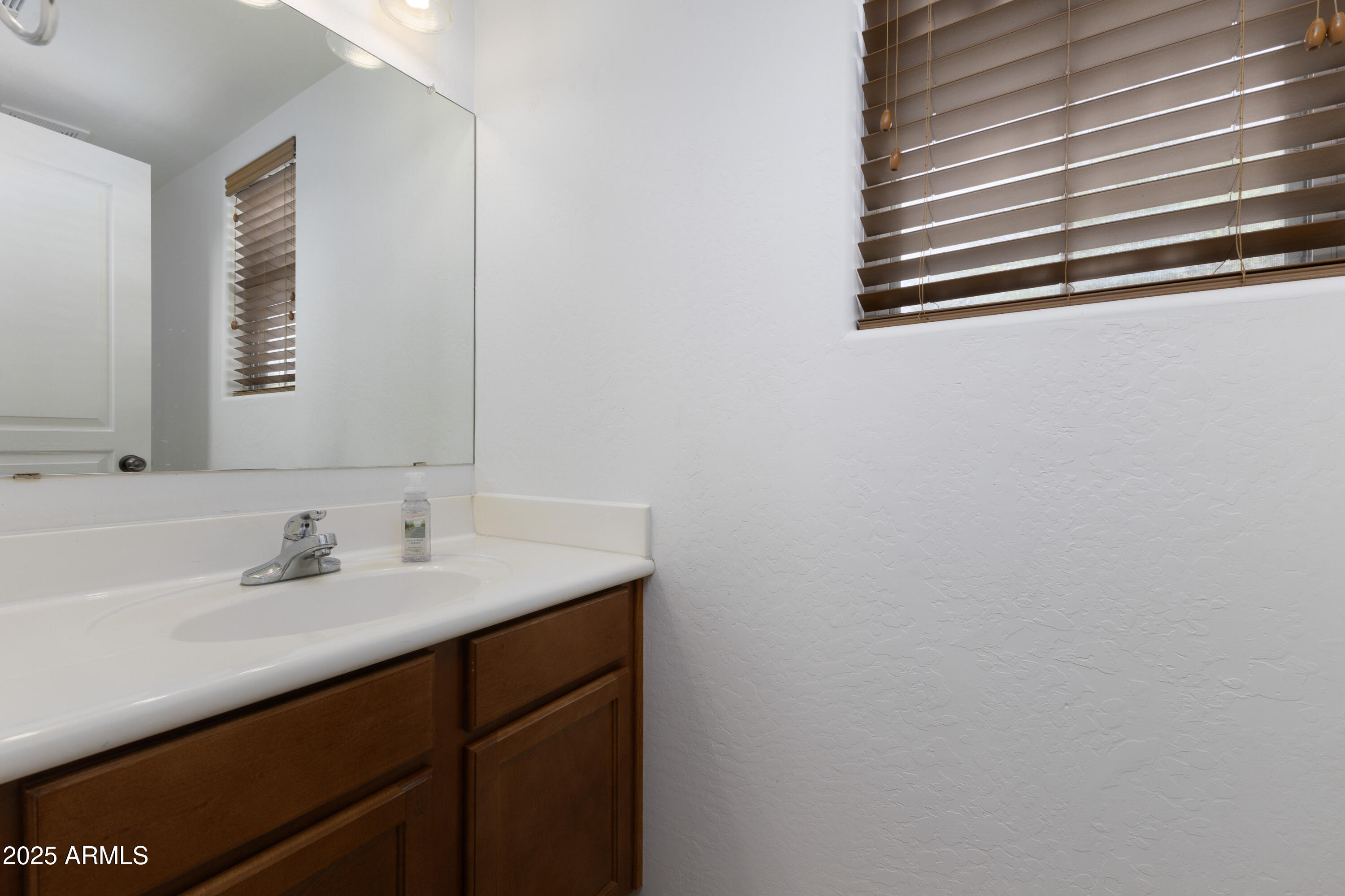 451 South Hawes Road, Unit 53 Mesa, AZ 85208 - Photo 12 of 37 a bathroom with a sink and a mirror