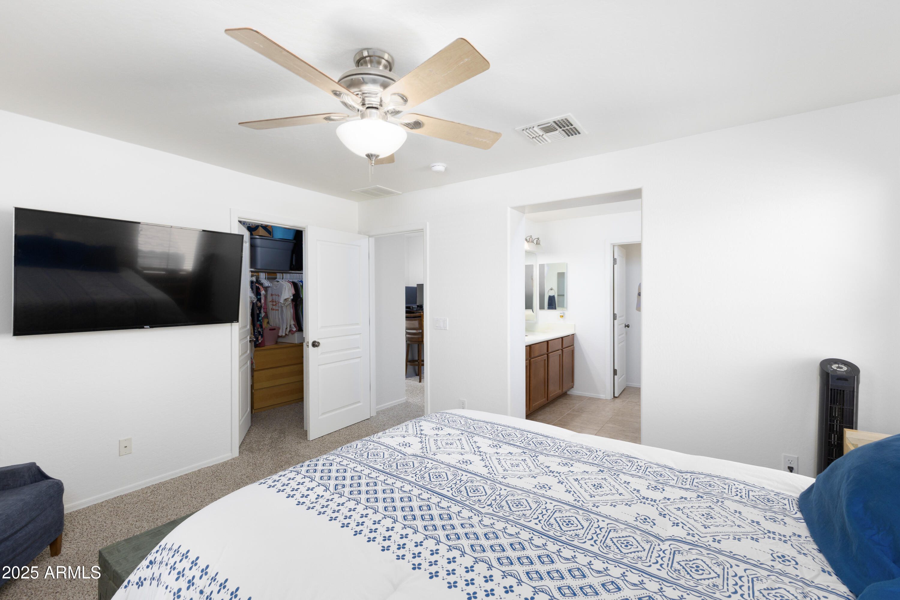 451 South Hawes Road, Unit 53 Mesa, AZ 85208 - Photo 17 of 37 a bedroom with a bed and a flat screen tv