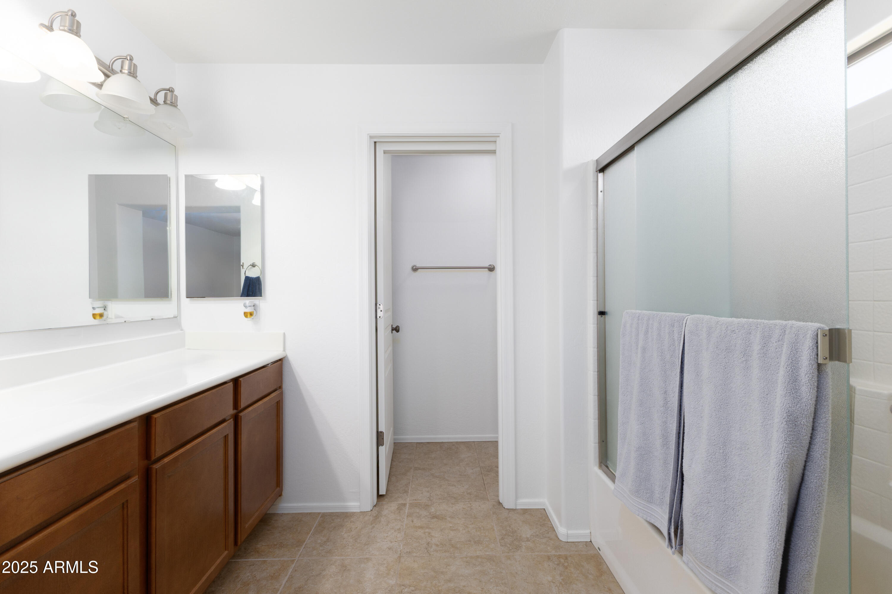 451 South Hawes Road, Unit 53 Mesa, AZ 85208 - Photo 18 of 37 a bathroom with a double vanity sink and mirror