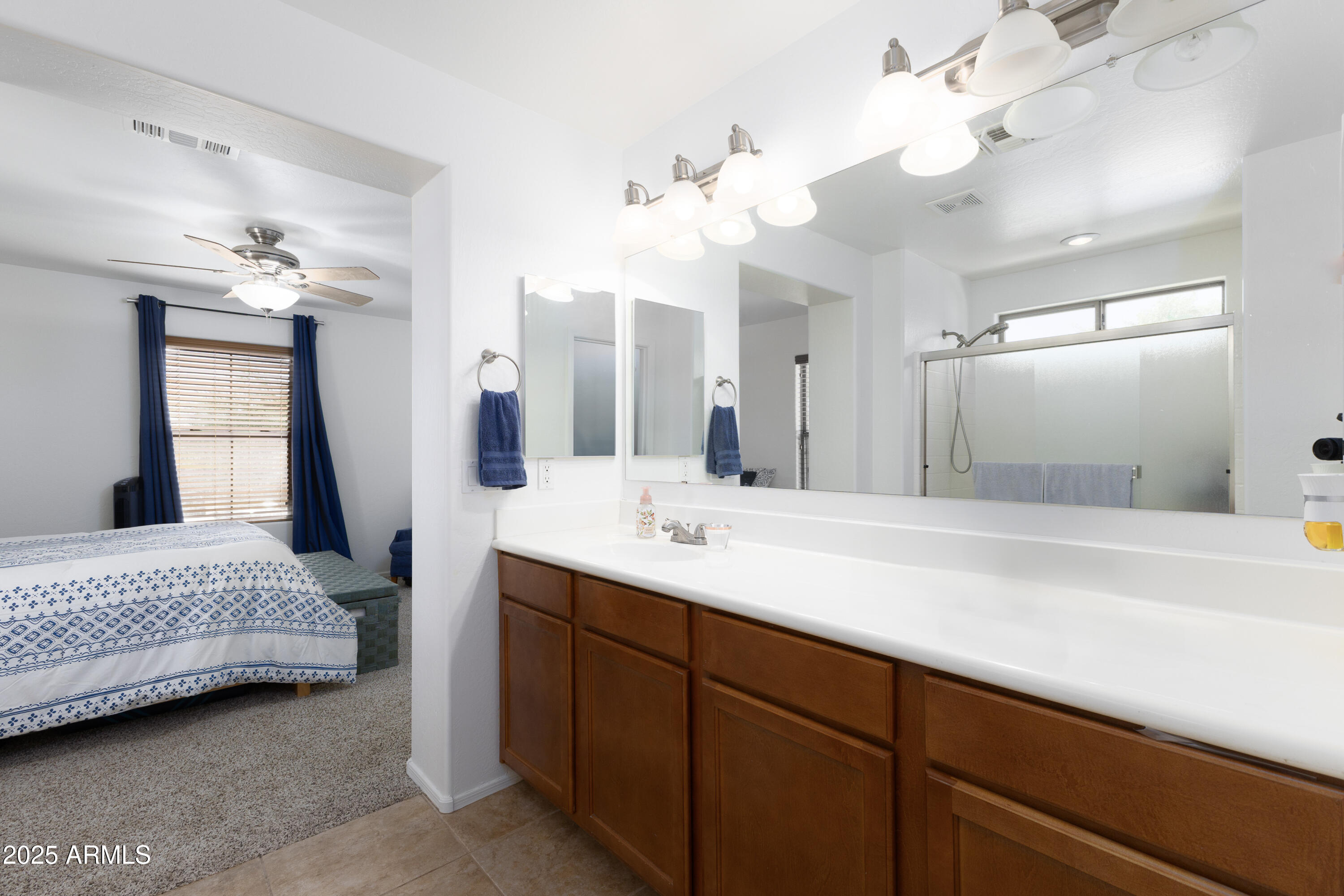 451 South Hawes Road, Unit 53 Mesa, AZ 85208 - Photo 19 of 37 a spacious bathroom with a double vanity sink a mirror and shower