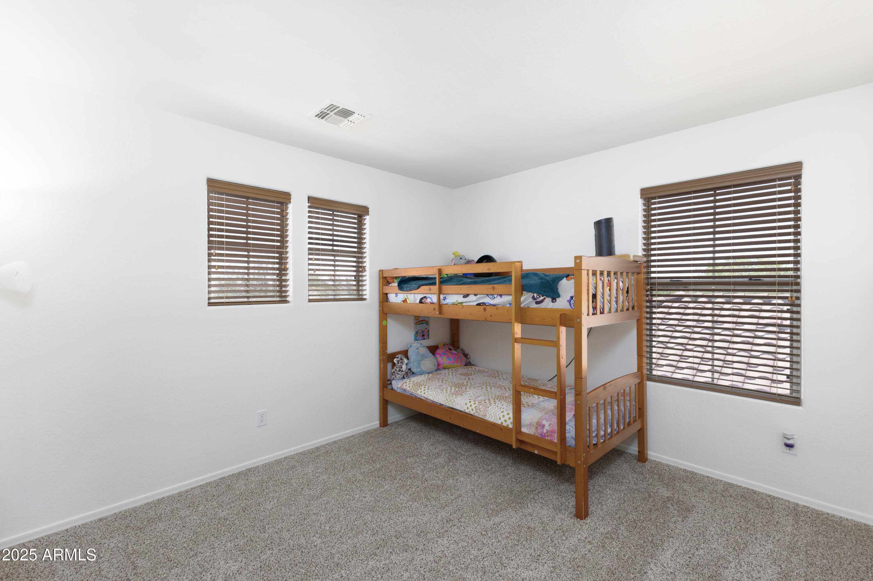 451 South Hawes Road, Unit 53 Mesa, AZ 85208 - Photo 29 of 37 a bedroom with furniture and window