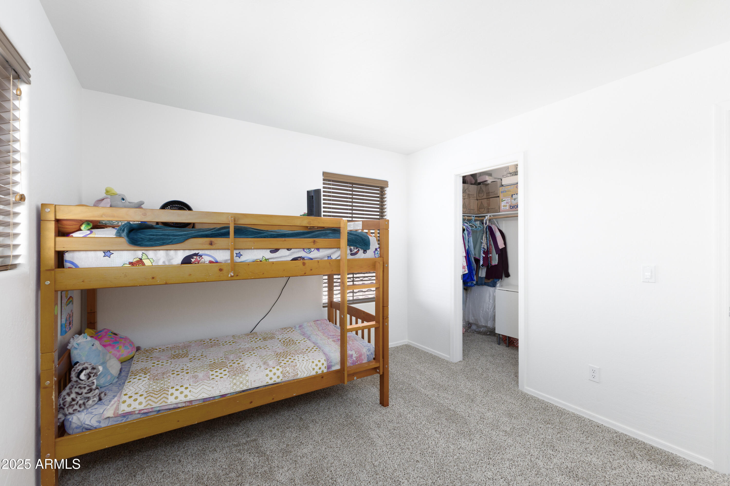 451 South Hawes Road, Unit 53 Mesa, AZ 85208 - Photo 30 of 37 a room with a bed and a table
