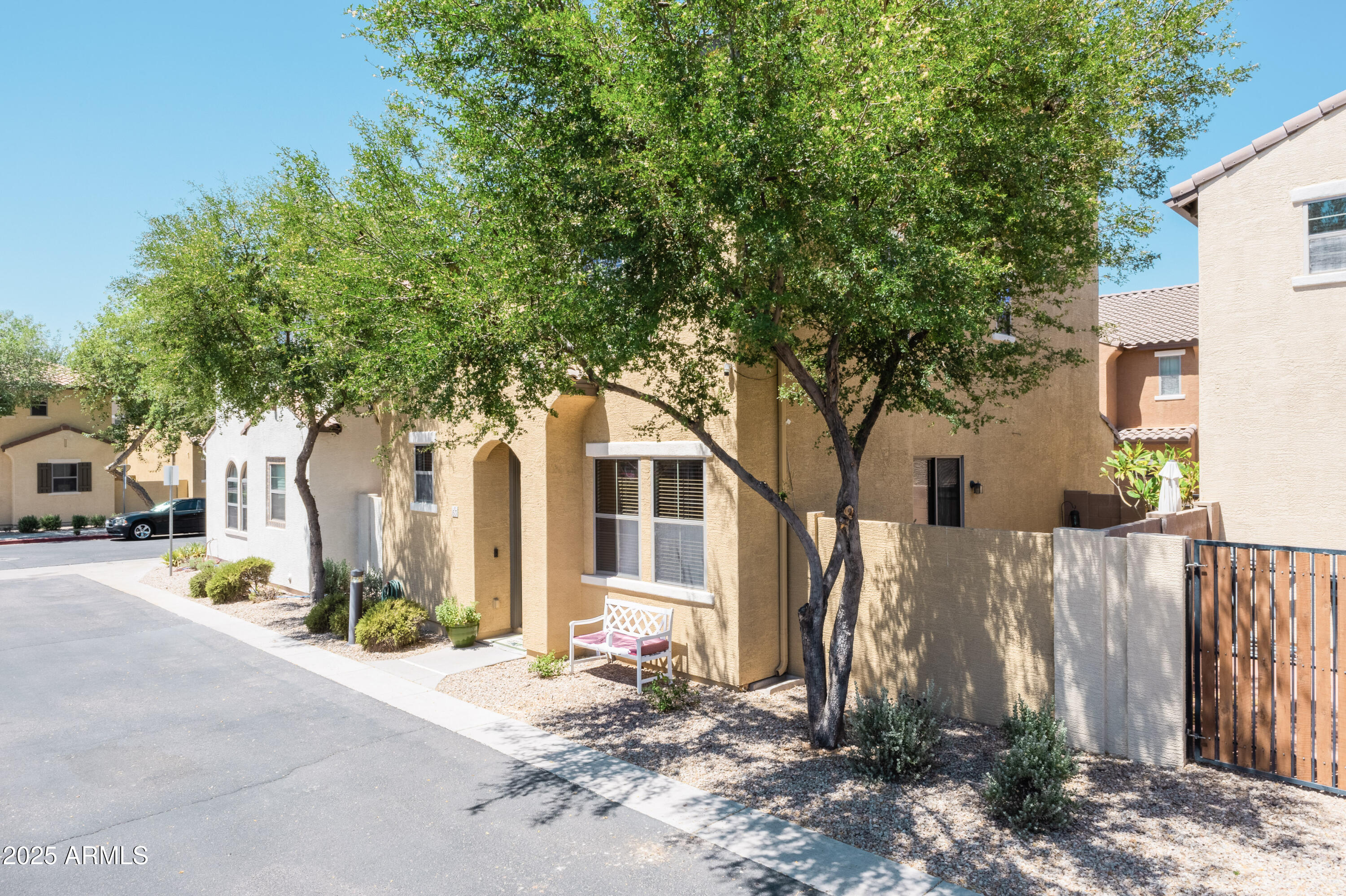 451 South Hawes Road, Unit 53 Mesa, AZ 85208 - Photo 3 of 37 a front view of a house with a yard and tree s