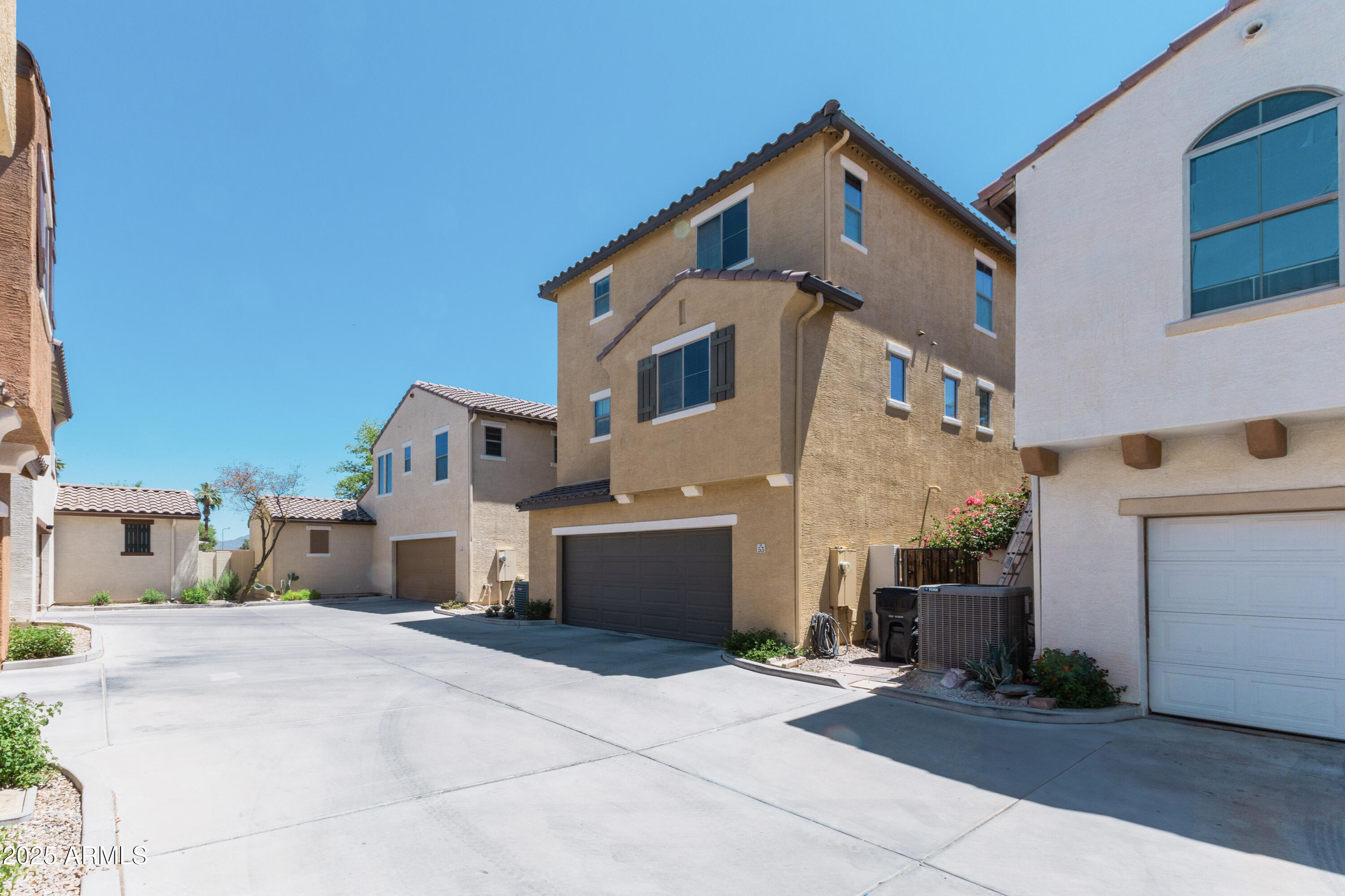 451 South Hawes Road, Unit 53 Mesa, AZ 85208 - Photo 33 of 37 a front view of a house with a yard