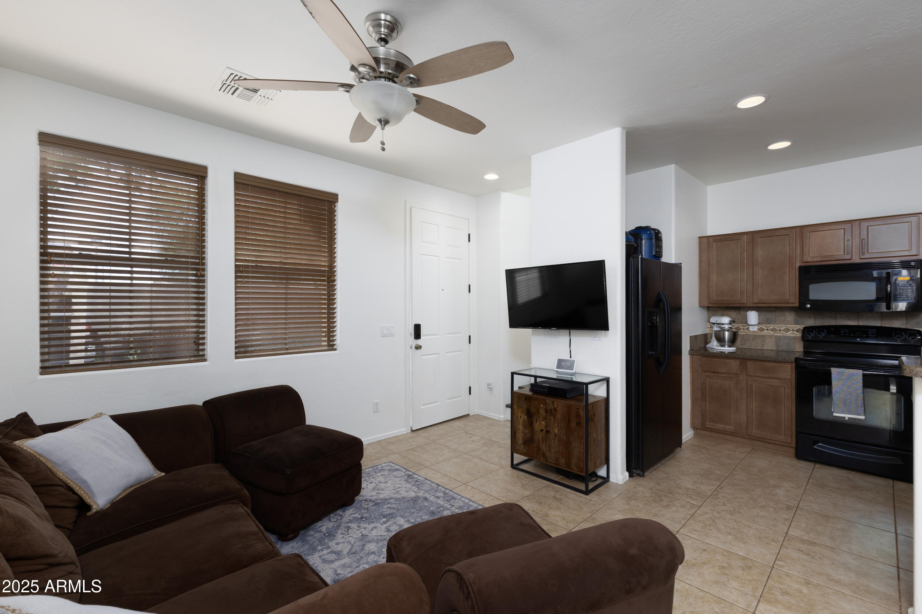 451 South Hawes Road, Unit 53 Mesa, AZ 85208 - Photo 5 of 37 a living room with furniture and a flat screen tv