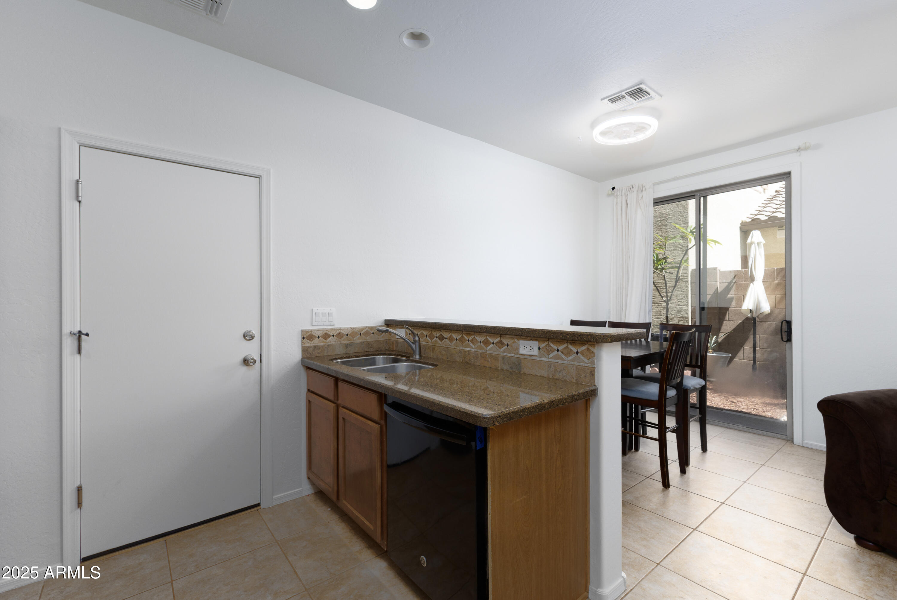 451 South Hawes Road, Unit 53 Mesa, AZ 85208 - Photo 8 of 37 a kitchen with a stove a table and chairs