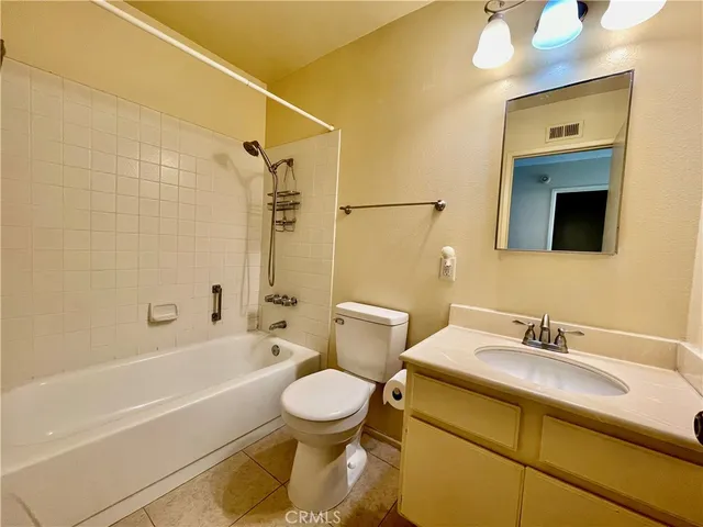 a bathroom with a toilet and a bathtub