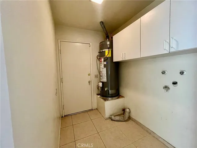 a view of a porch with furniture and floor to ceiling window